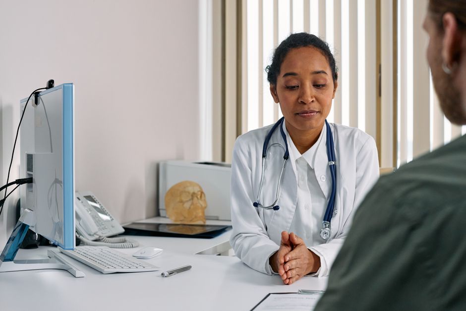 Patient reviewing a cancer screening package plan with an English-speaking physician at a Seoul clinic in South Korea