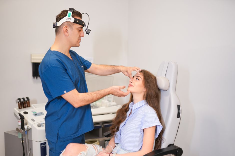 Plastic surgeon consulting a patient before double eyelid surgery in Korea