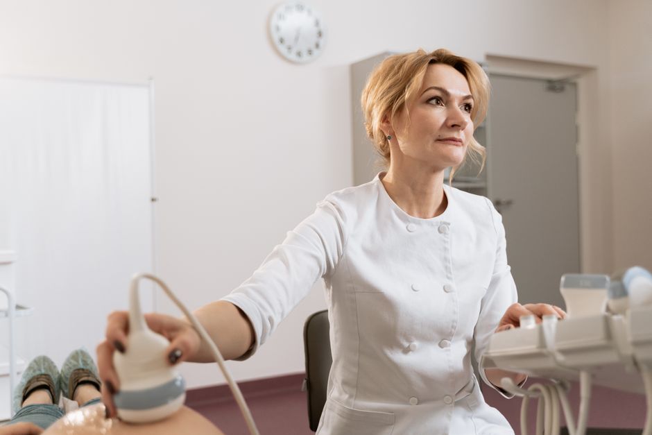 Gynecologist discussing hysterectomy options with a patient