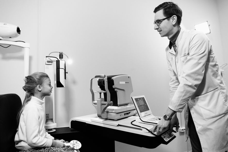 Ophthalmologist assessing patient before LASIK eye surgery in Korea