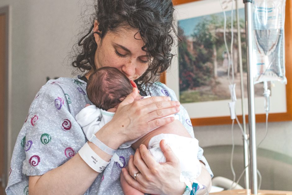 Mother and newborn after delivery following prenatal care in Korea, illustrating postpartum recovery