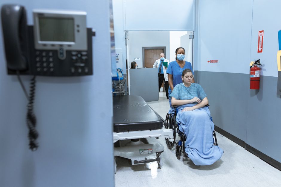Scoliosis surgery patient doing physiotherapy walking in Korean hospital during recovery